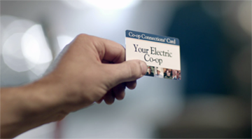 Co-op connections card in hand